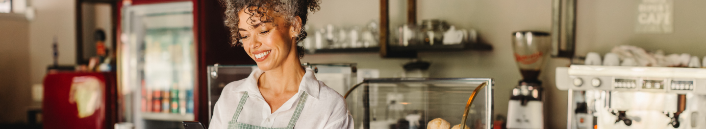 A small business owner working in her coffee shop.