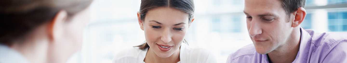 Financial professional discussing life insurance with existing P&C customers.