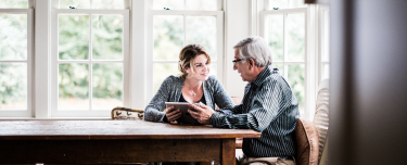 A financial professional talking to a client about Medicare.