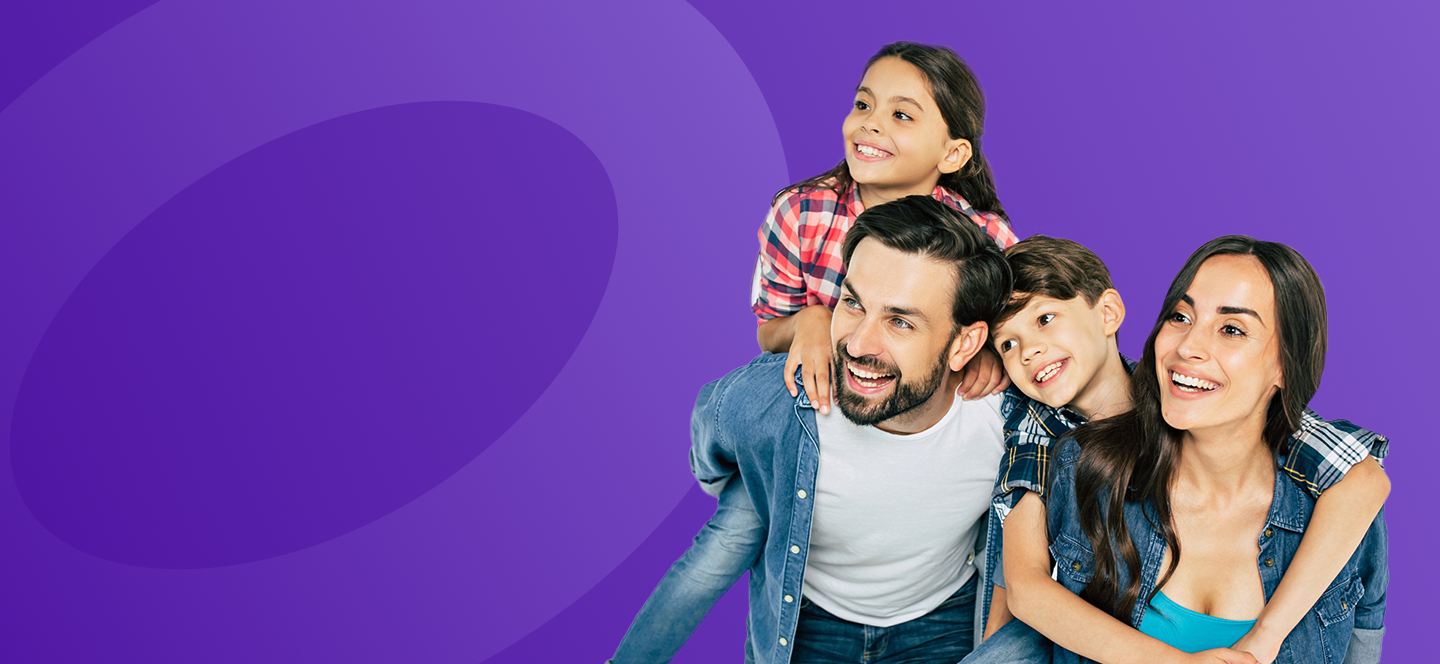 A smiling mother, father and their two children.