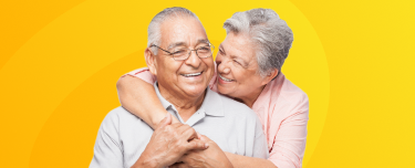 A retired couple smiling. 