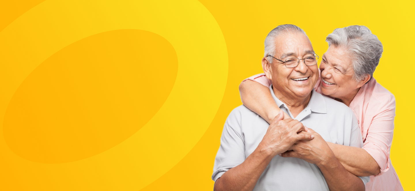 A retired couple smiling. 