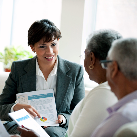 Professional discussing potential retirement income risks with a client.