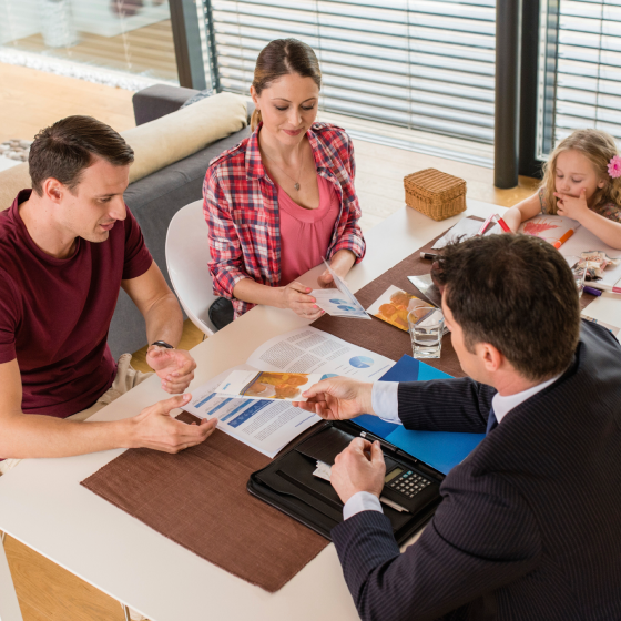 A financial professional sharing life insurance information about optional benefits and riders with his clients