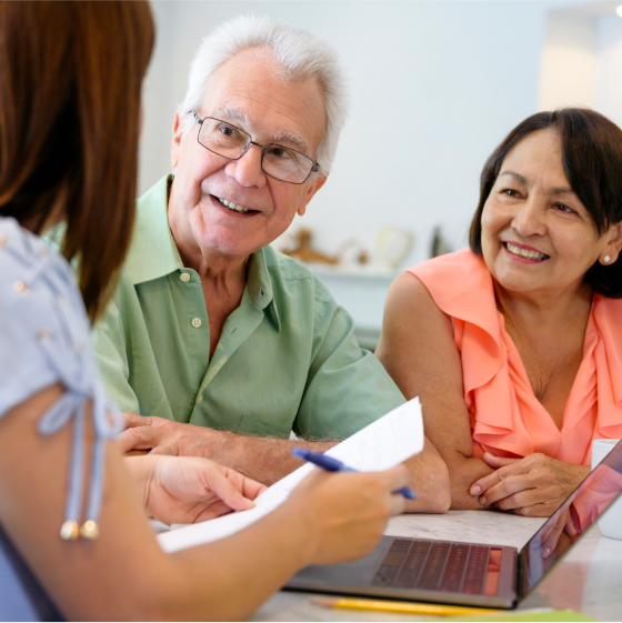 Financial professional speaking with couple who represent the ideal clients for an immediate annuity.