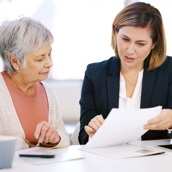 A financial professional explaining common Medicare myths to her client.