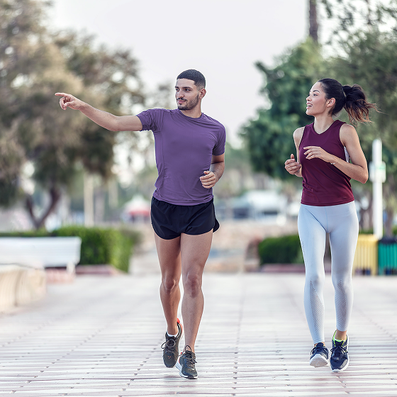 Man and woman jogging, representing people who do not think they need life insurance because they're healthy.