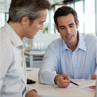Professional discussing retirement income risks with client