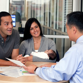  Agent chats with new parent about protecting their family’s financial future with life insurance.