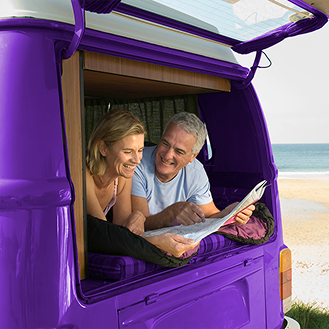 Couple relaxing on a road trip after purchasing an indexed annuity for balanced growth and protection.