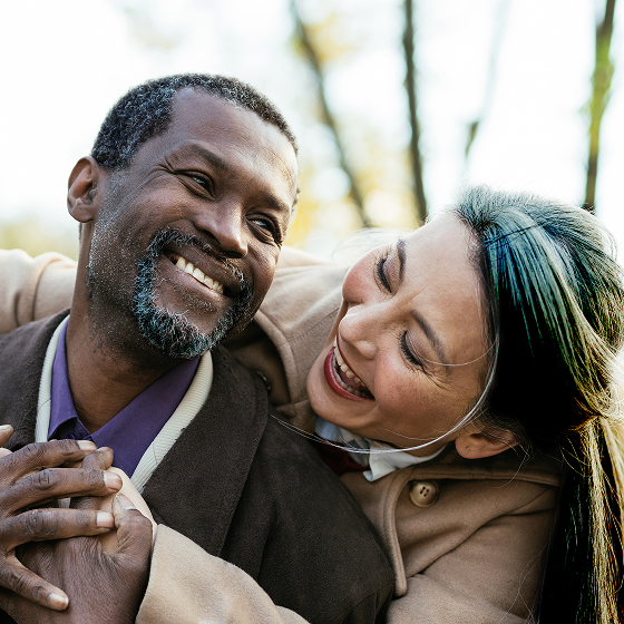 A couple share a hug knowing they're protected with Protective Income Creator fixed annuity.