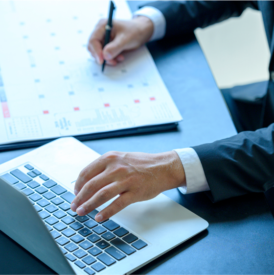 Agent uses a calendar to plan when he will contact clients based on their policy anniversary.