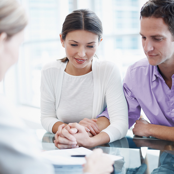 Financial professional discussing life insurance with existing P&C clients.