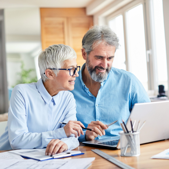 Couple working on their estate plan as part of the retirement planning process. 