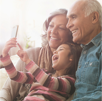 Grandparents smile with their grandson as they think about the financial legacy they've created with Protective Series Estate Maximizer℠ II.